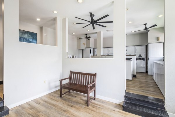 Laundry facility with modern washers and dryers at Avana at Happy Valley Apartments luxury community