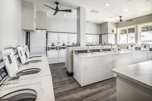 Modern laundry facility at Avana at Happy Valley Apartments, featuring state-of-the-art appliances