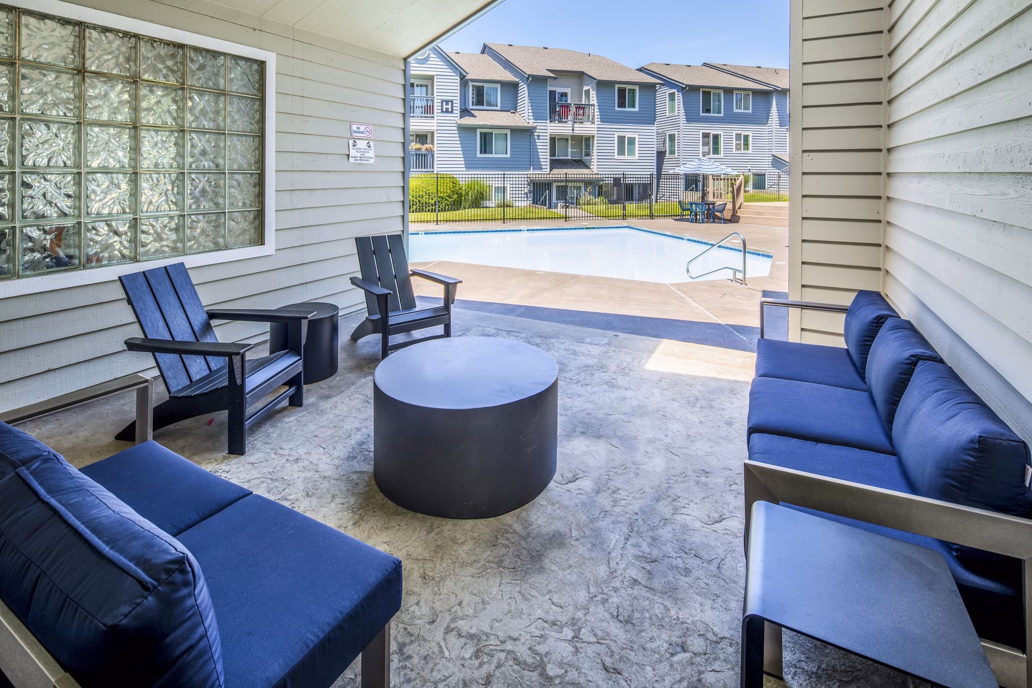 Stylish pool and patio area at Avana at Happy Valley Apartments, ideal for relaxation and outdoor gatherings in a luxury setting