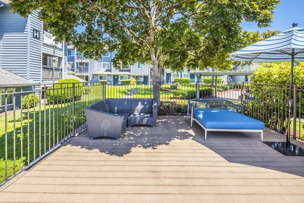 Outdoor patio with stylish seating at Avana at Happy Valley Apartments, perfect for relaxation and socializing