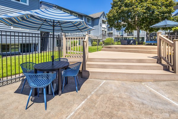 Patio area featuring stylish outdoor seating at Avana at Happy Valley Apartments