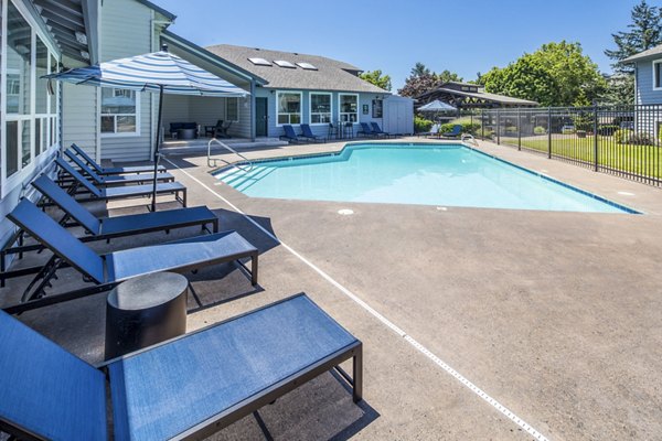 Resort-style pool with lounge chairs at Avana at Happy Valley Apartments