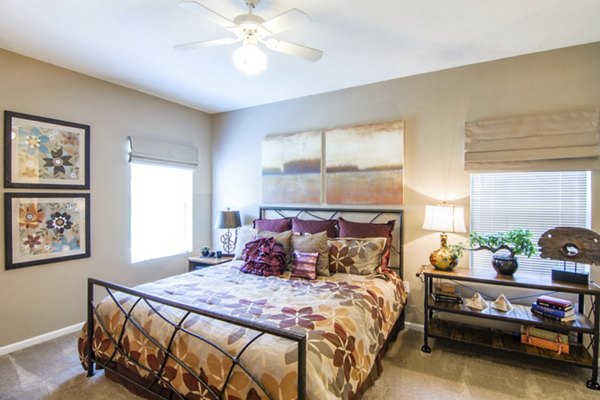 Bedroom with elegant decor and modern furnishings at Estancia at City Center Apartments