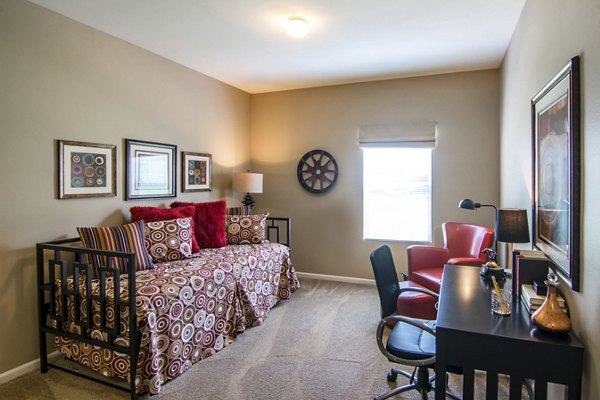 Bedroom featuring elegant design and modern furniture in Estancia at City Center Apartments