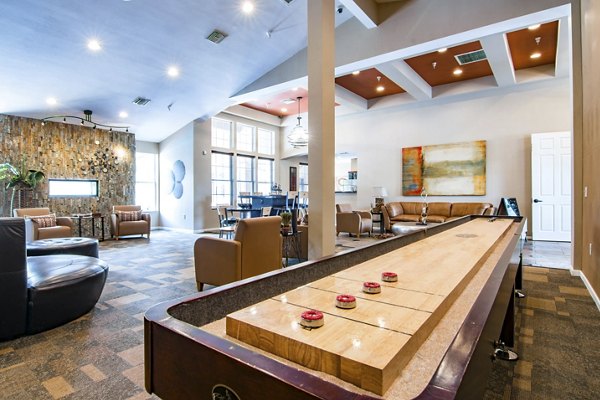 Spacious clubhouse with modern decor at Estancia at City Center Apartments, perfect for socializing and community events