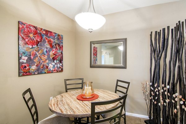 Dining room with modern decor and elegant lighting at Estancia at City Center Apartments