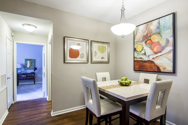 Dining room featuring elegant lighting and modern furnishings in Estancia at City Center Apartments