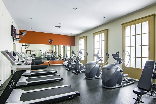 Modern fitness center with state-of-the-art equipment at Estancia at City Center Apartments