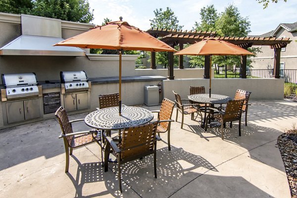Grill area featuring BBQ stations at Estancia at City Center Apartments