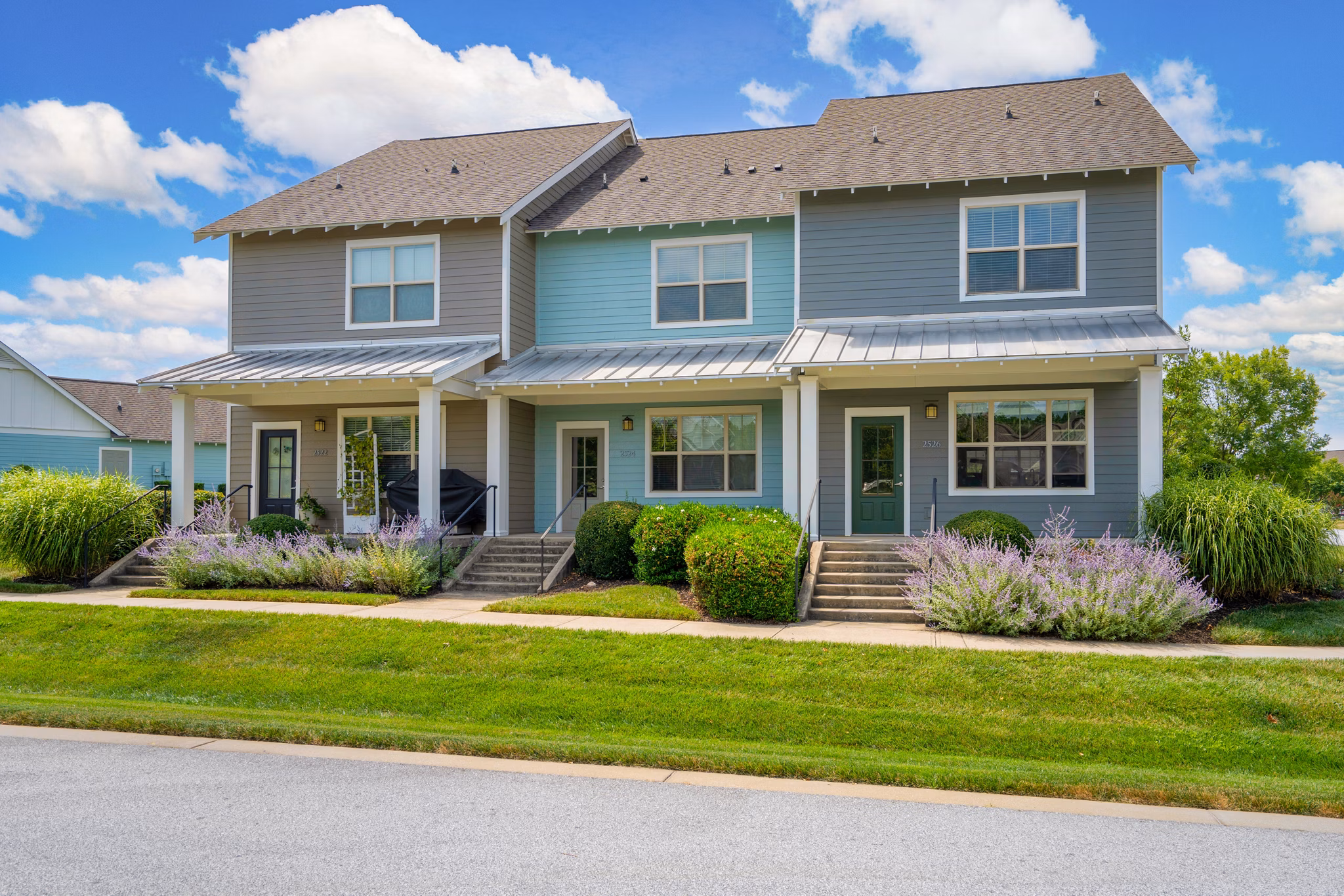 Homestead at Hartness: Scenic view of luxury apartments surrounded by lush greenery
