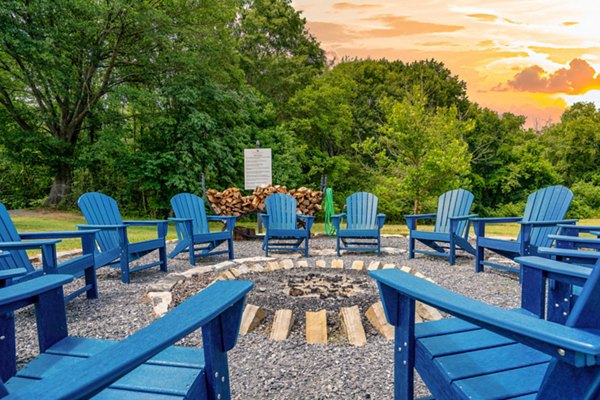 Cozy outdoor fire pit area at Homestead at Hartness Apartments
