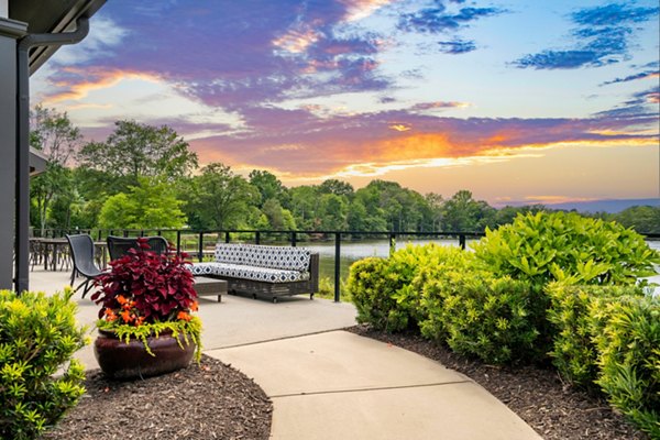 Courtyard garden with outdoor seating at Homestead at Hartness Apartments, perfect for relaxation and gatherings in luxury setting