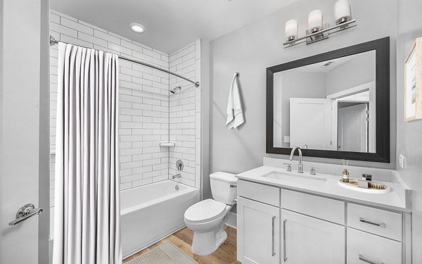 Elegant bathroom with marble countertops at The Boulevard Apartments, offering luxury living and modern design