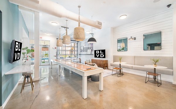 Clubhouse featuring modern design and cozy seating at The Boulevard Apartments