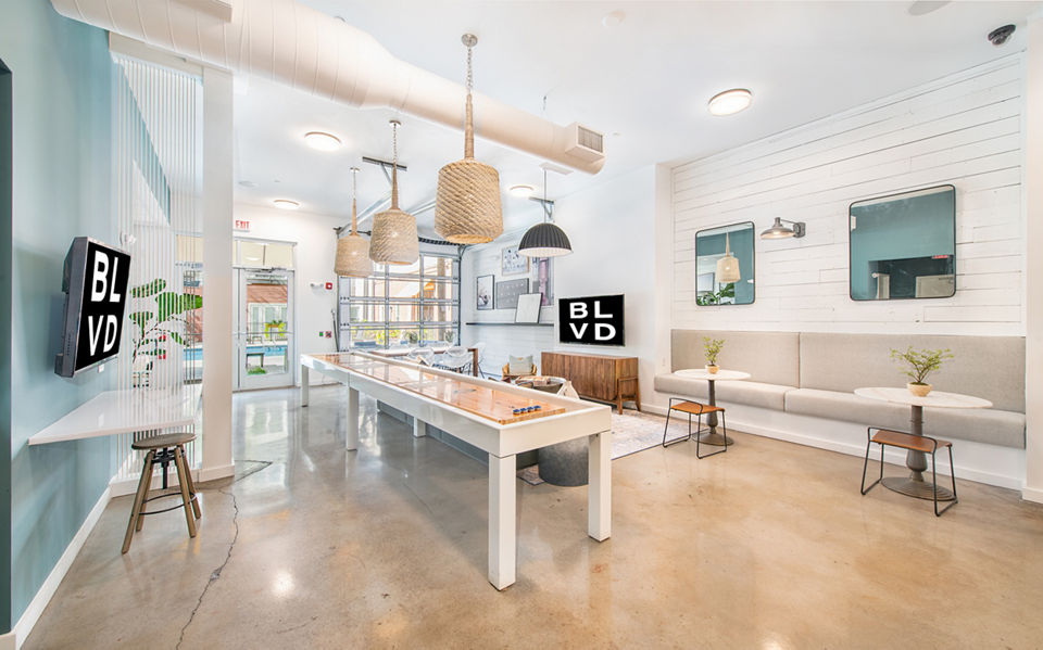 Clubhouse featuring modern design and cozy seating at The Boulevard Apartments