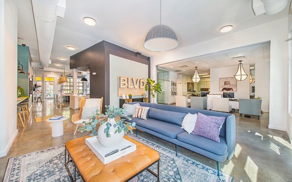 Clubhouse interior featuring modern design and cozy seating at The Boulevard Apartments
