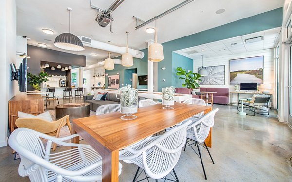 Modern clubhouse with communal seating and game area at The Boulevard Apartments