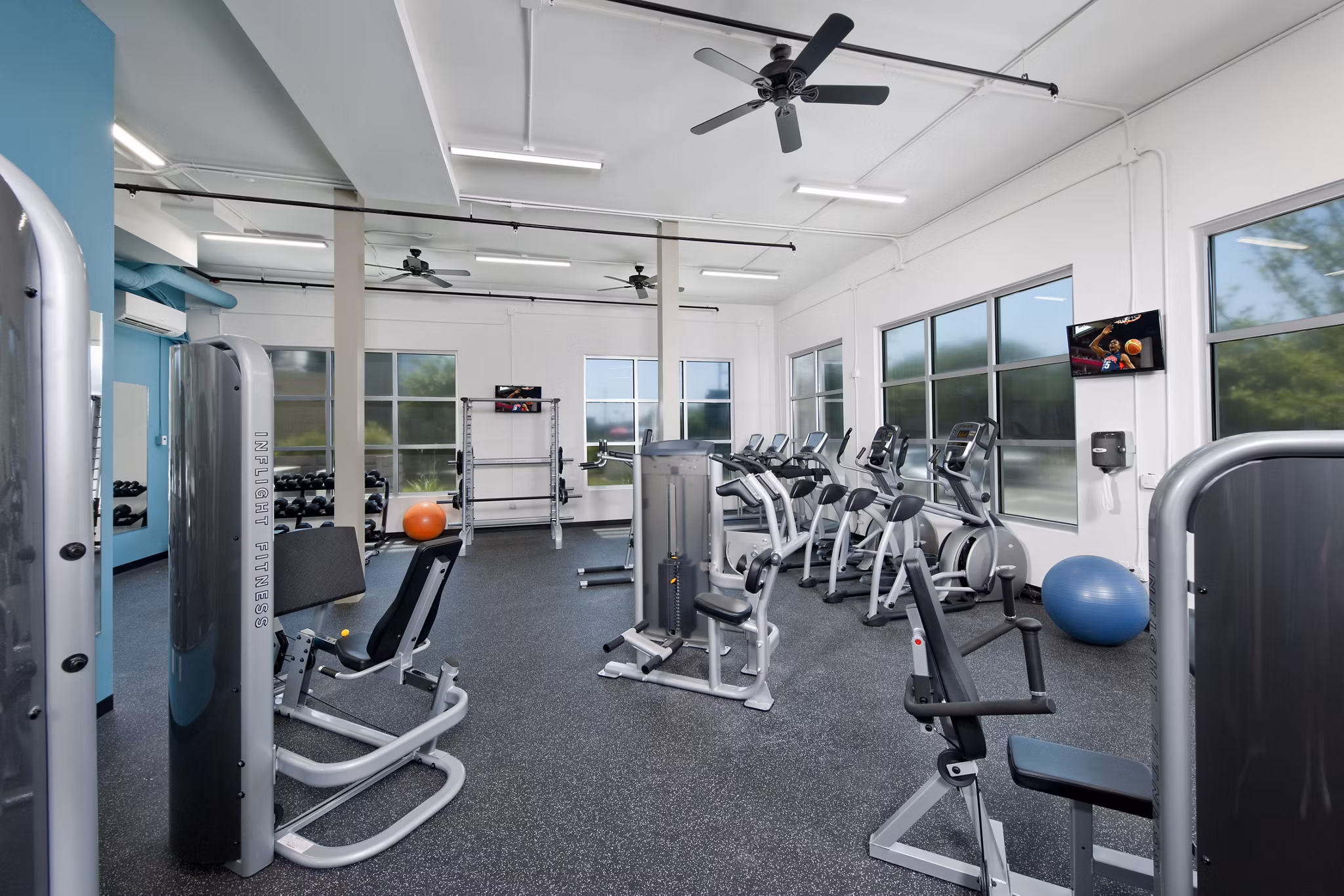 State-of-the-art fitness center at The Boulevard Apartments featuring modern exercise machines