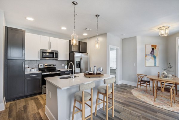 Modern kitchen with sleek cabinetry and stainless steel appliances in The Boulevard Apartments