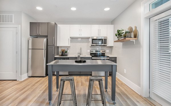 Modern kitchen featuring stainless steel appliances in The Boulevard Apartments