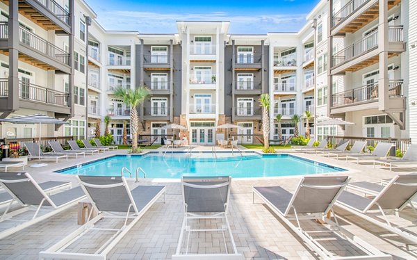 Pool with cabanas at The Boulevard Apartments, a Greystar luxury community