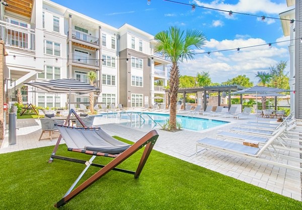 Spacious patio with modern seating at The Boulevard Apartments, perfect for relaxation and gatherings Luxury outdoor living in a Greystar community