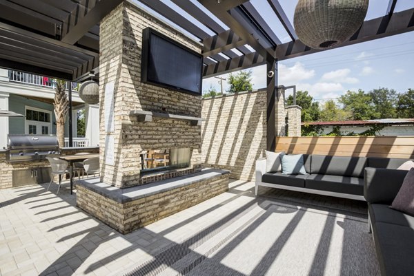 Patio with cozy seating and garden view at The Boulevard Apartments