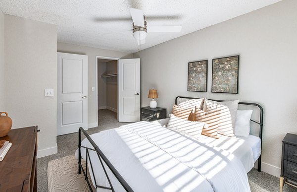 Bedroom with modern decor at Terra Vista at the Park Apartments featuring luxury design and spacious layout