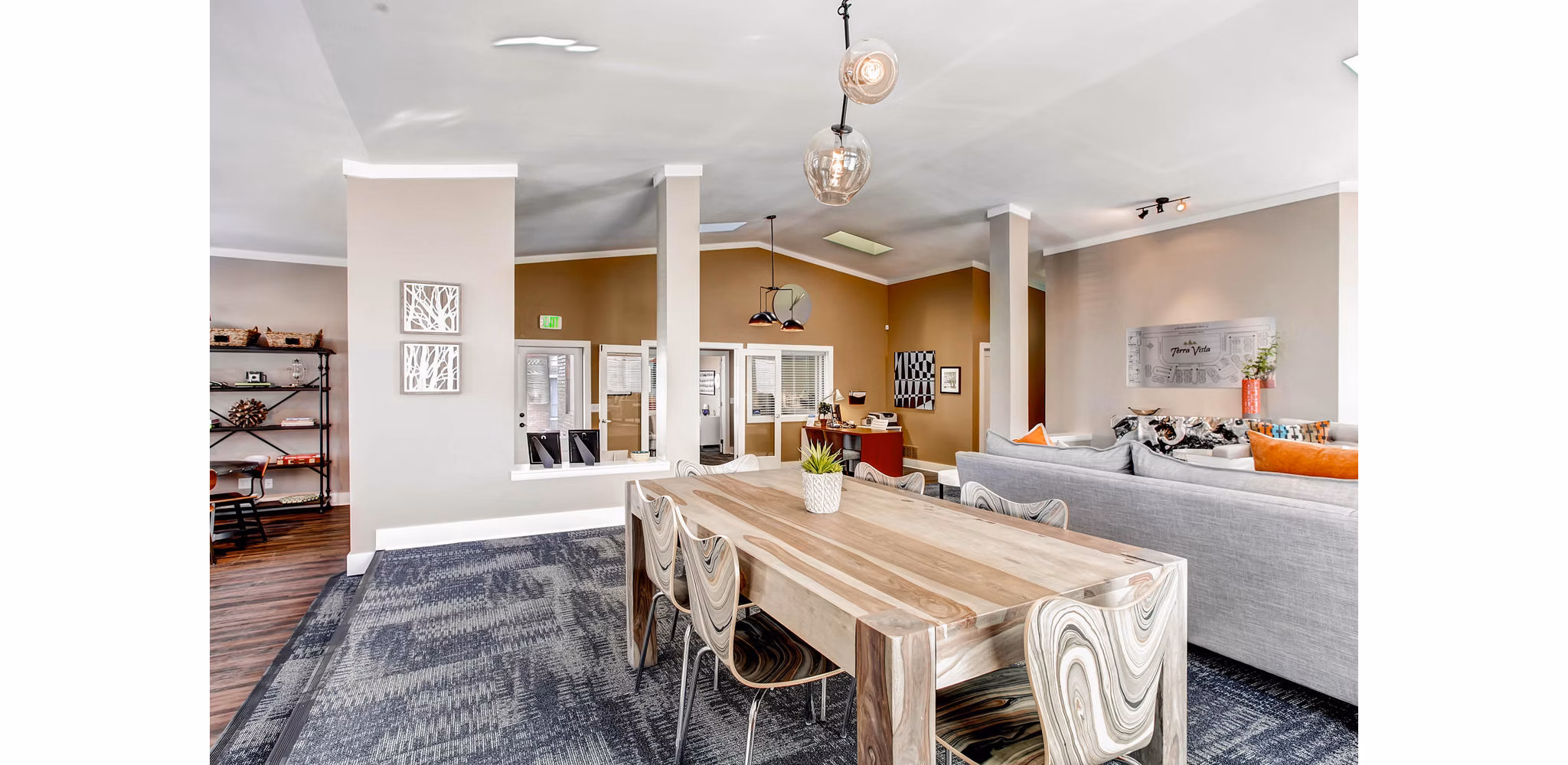 Modern clubhouse with lounge seating and a fireplace at Terra Vista at the Park Apartments, offering stylish amenities for residents