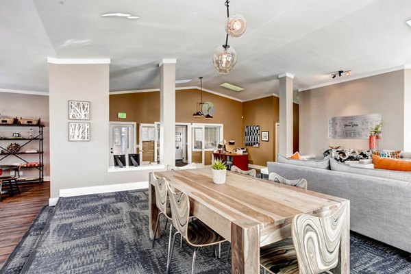 Modern clubhouse with lounge seating and a fireplace at Terra Vista at the Park Apartments, offering stylish amenities for residents