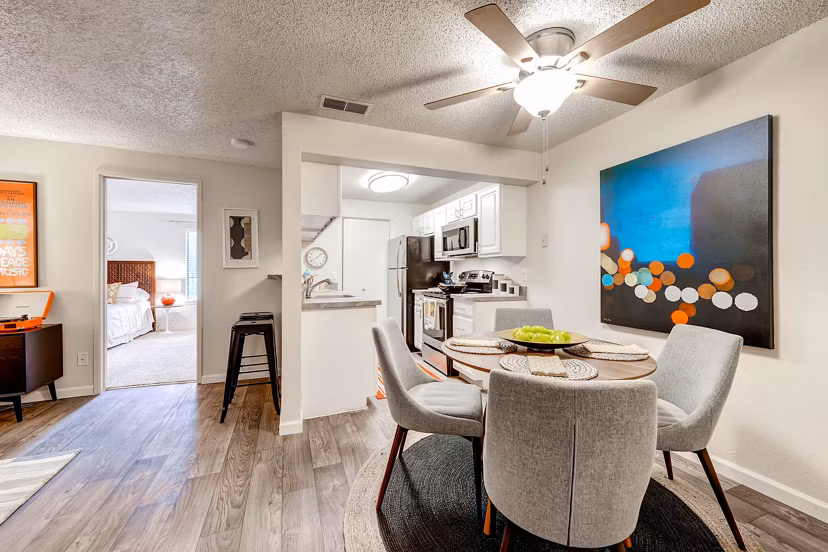 Dining area and in-unit laundry at Terra Vista at the Park Apartments, offering modern conveniences and stylish interiors for a comfortable living experience