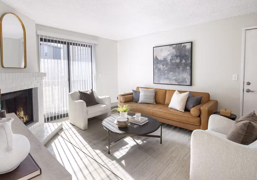 Cozy living room with natural light and stylish furniture at Terra Vista at the Park Apartments, offering comfortable living spaces