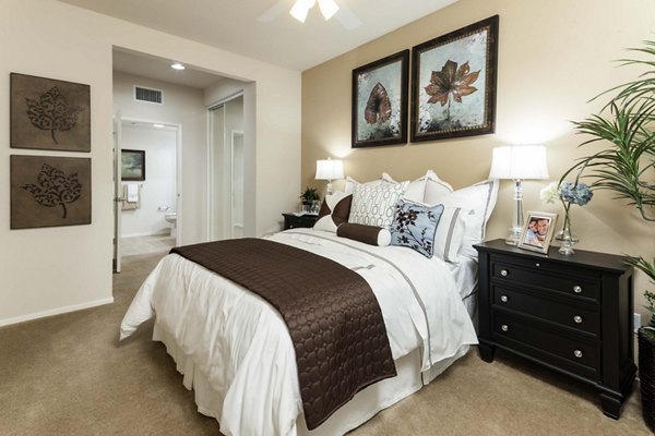 Modern bedroom with river views in Overture Riverwalk Apartments