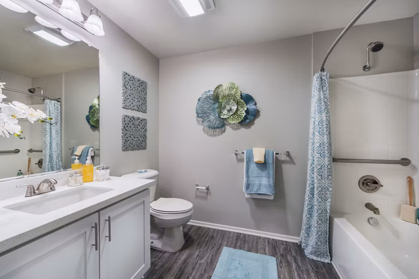 Bathroom featuring modern fixtures and double vanity at Overture Riverwalk luxury apartments
