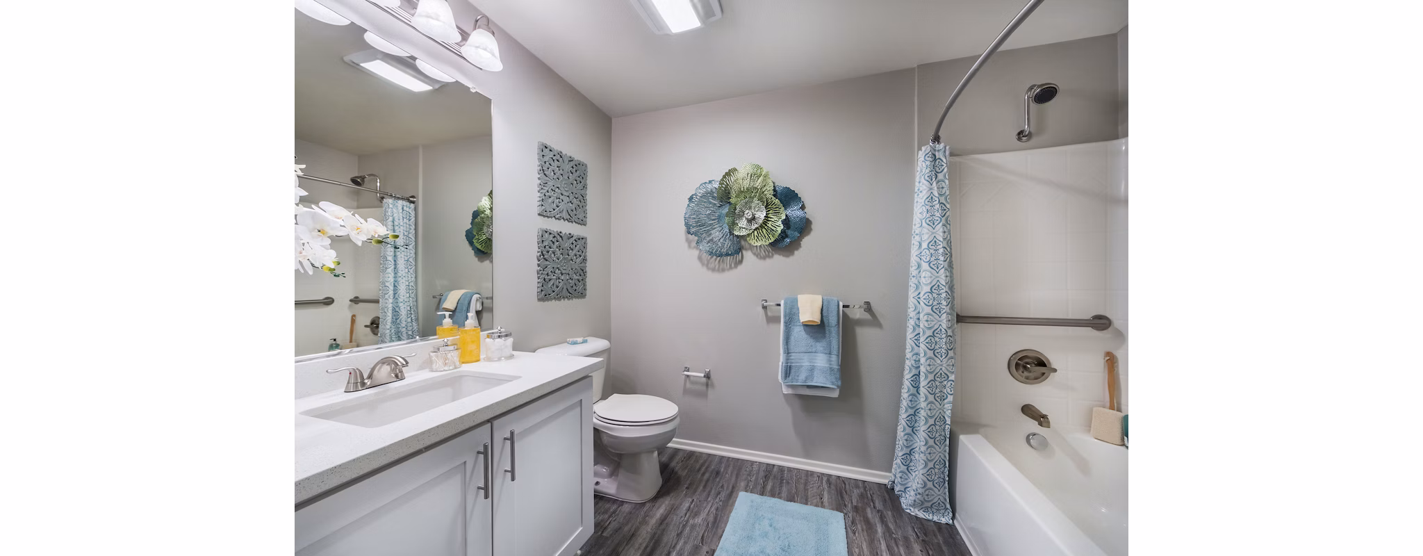 Bathroom featuring modern fixtures and double vanity at Overture Riverwalk luxury apartments