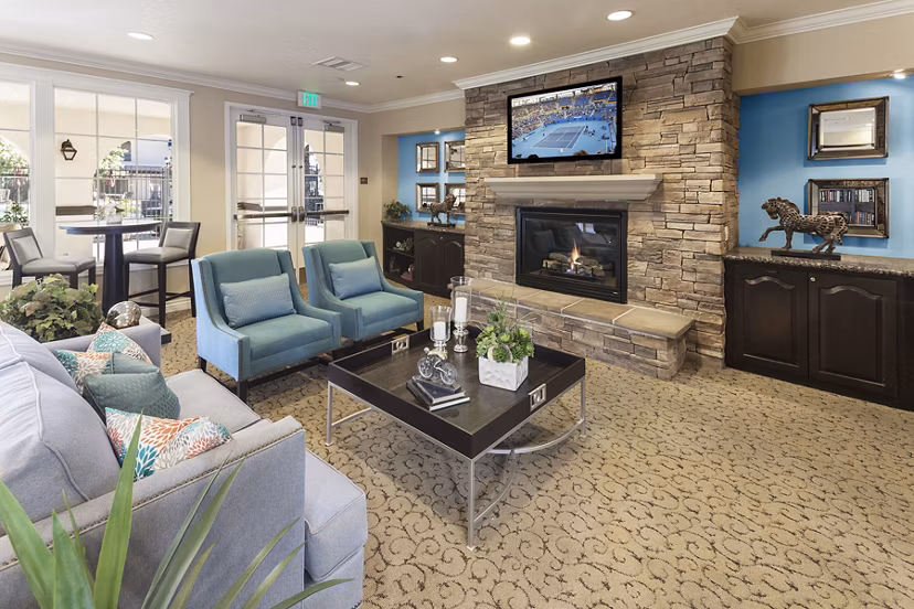 Clubhouse library with cozy reading nooks and bookshelves at Overture Riverwalk luxury apartments