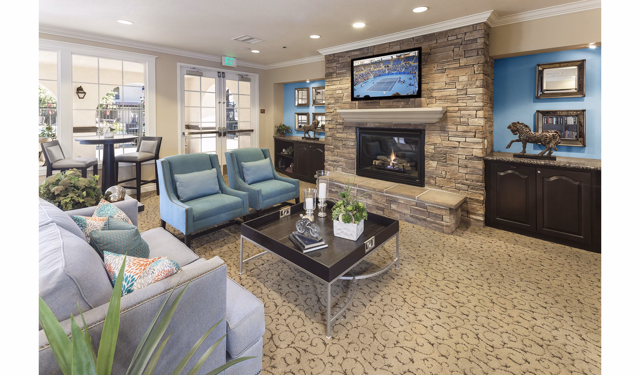 Clubhouse library with cozy reading nooks and bookshelves at Overture Riverwalk luxury apartments