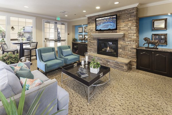 Clubhouse library with cozy reading nooks and bookshelves at Overture Riverwalk luxury apartments