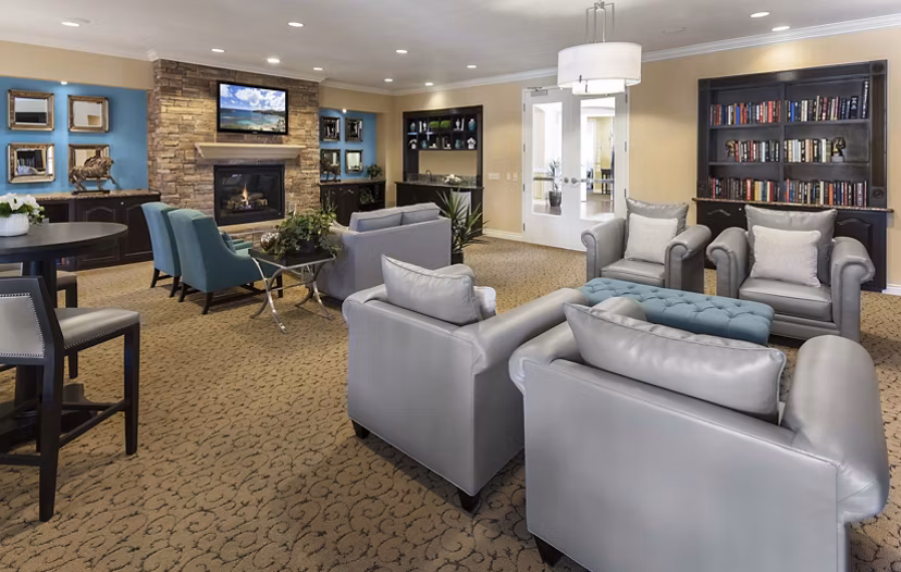 Clubhouse with modern furnishings at Overture Riverwalk Apartments, a Greystar luxury community in Riverside, showcasing stylish and inviting spaces