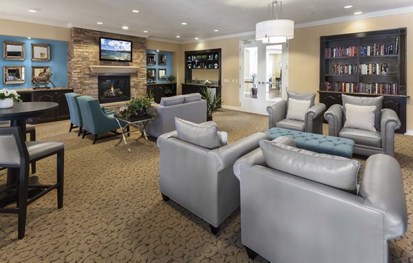 Clubhouse with modern furnishings at Overture Riverwalk Apartments, a Greystar luxury community in Riverside, showcasing stylish and inviting spaces