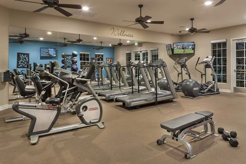 Fitness center with modern equipment at Overture Riverwalk Apartments