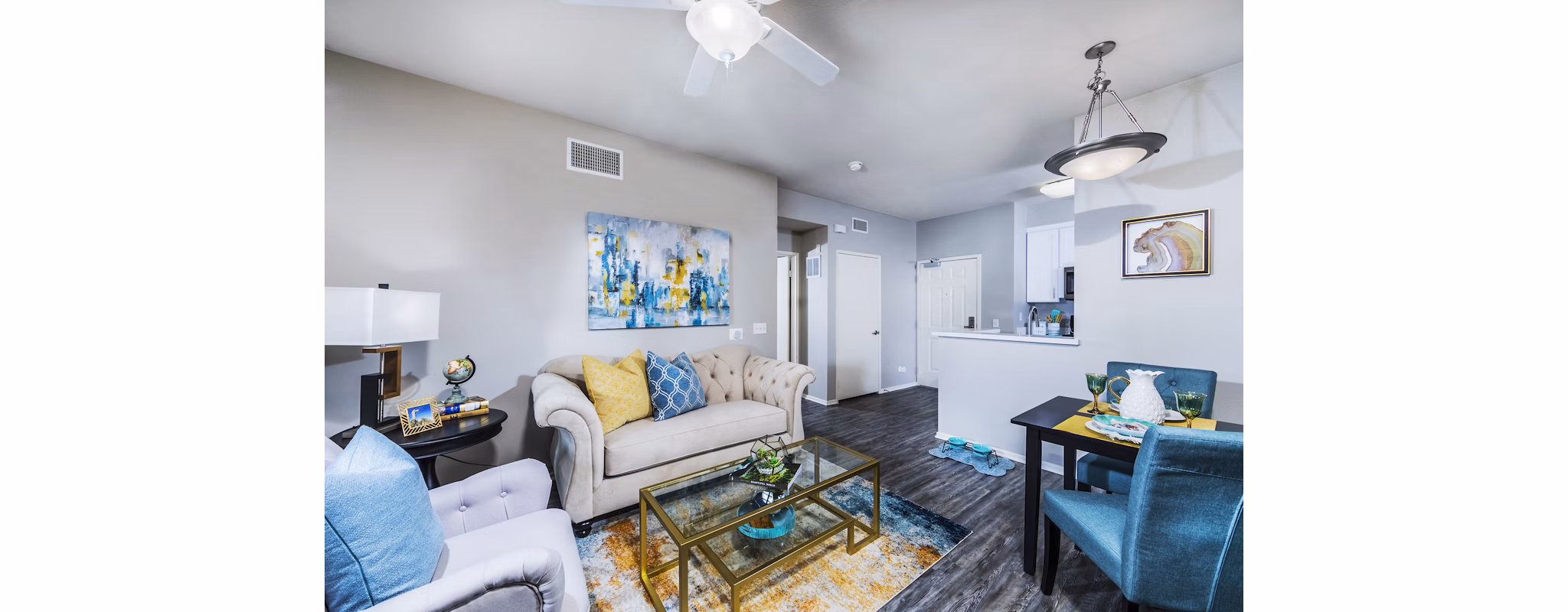 Elegant living room with modern decor and large windows in Overture Riverwalk luxury apartments