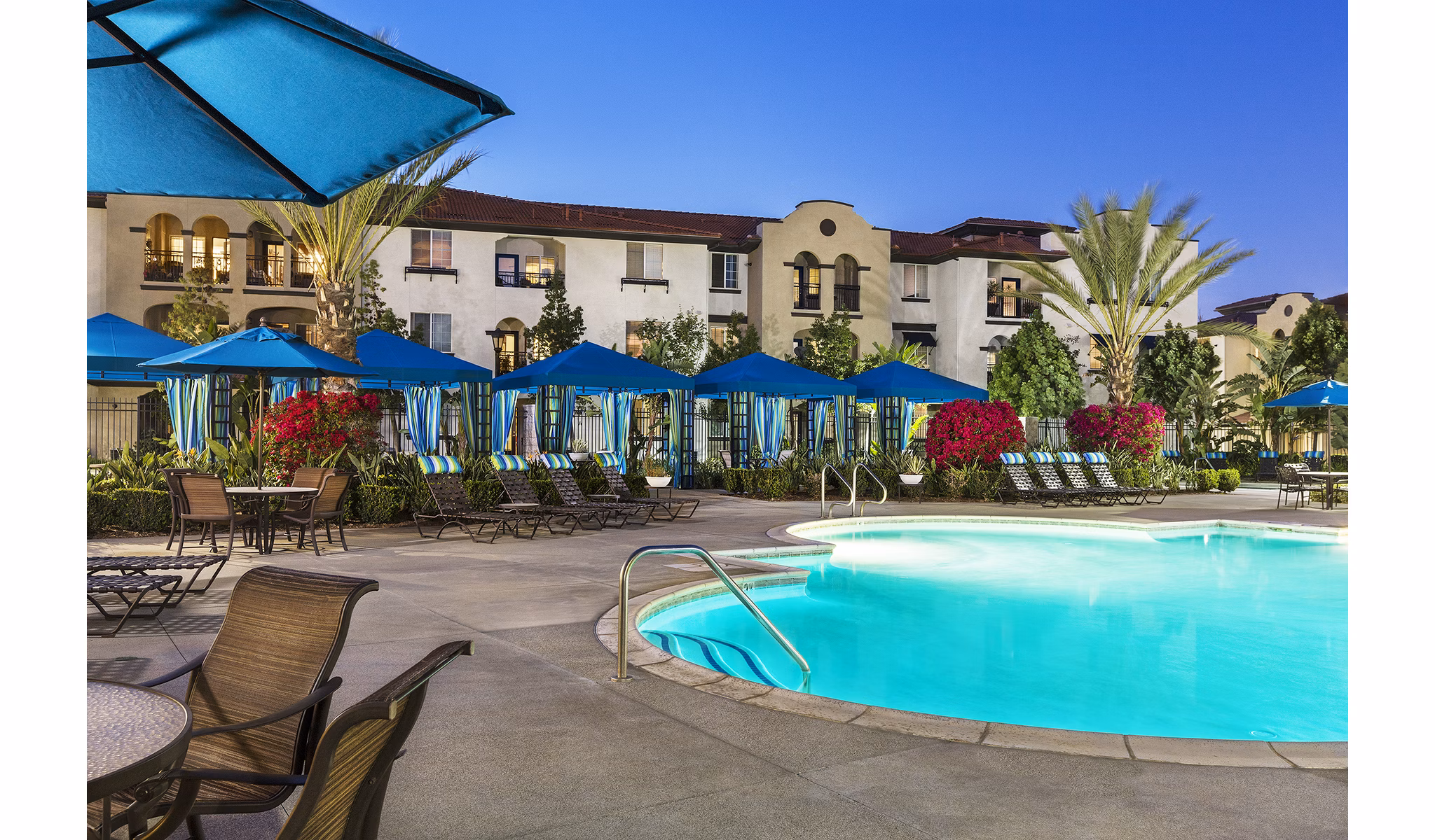 Resort-style pool with lounge seating at Overture Riverwalk luxury apartments