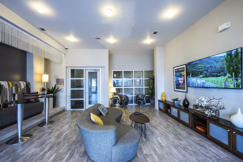 Stylish clubhouse with modern decor at Corazon Apartments, perfect for social gatherings and events