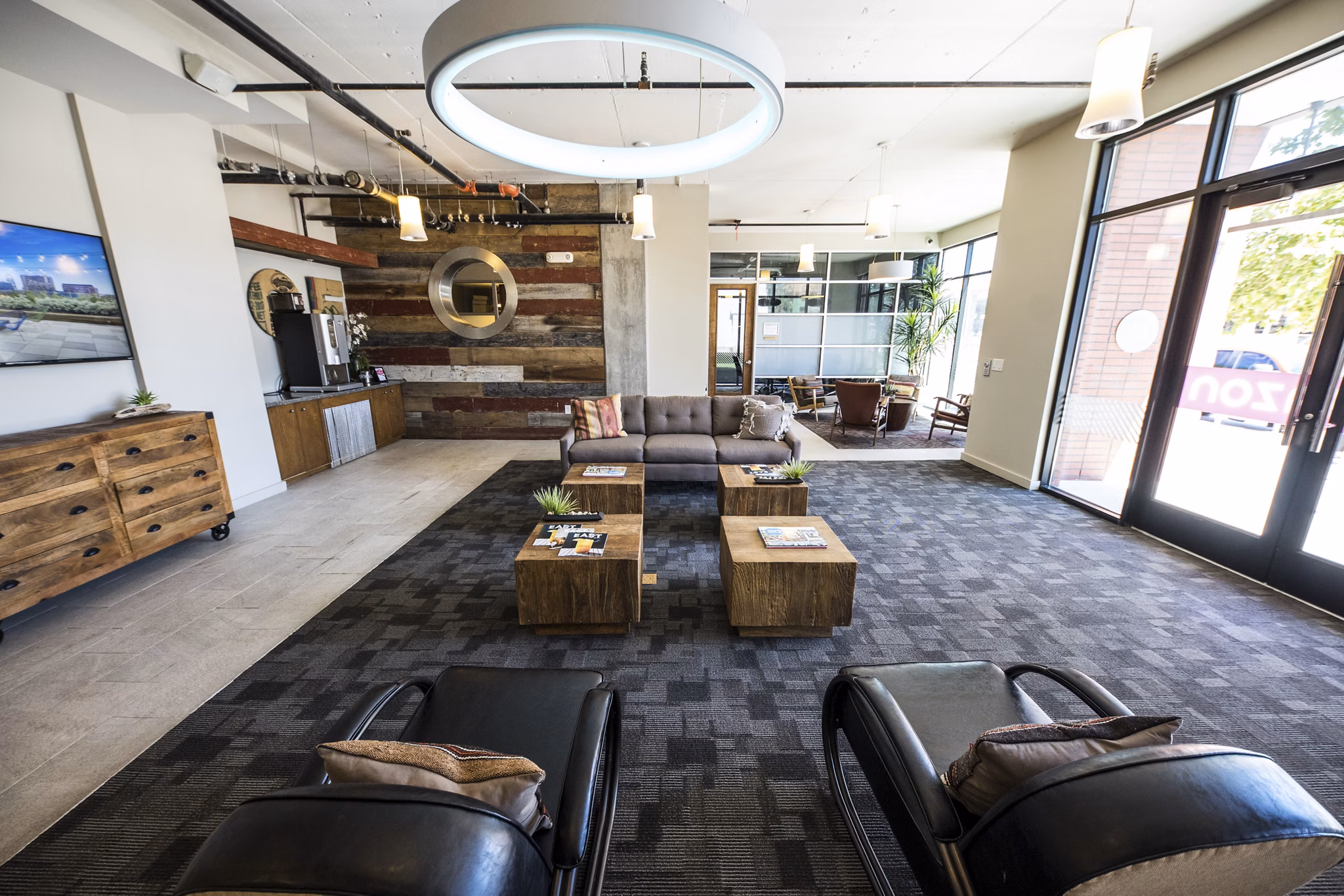 Clubhouse featuring modern design and cozy seating at Corazon Apartments in Austin