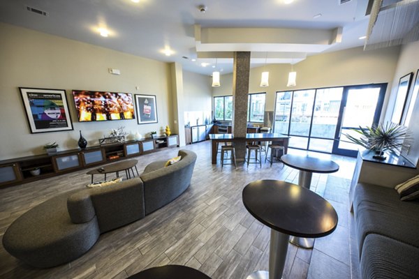 Stylish clubhouse with modern decor at Corazon Apartments, perfect for social gatherings and relaxation