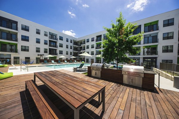 Outdoor grill area with sleek design at Corazon Apartments, perfect for entertaining in style