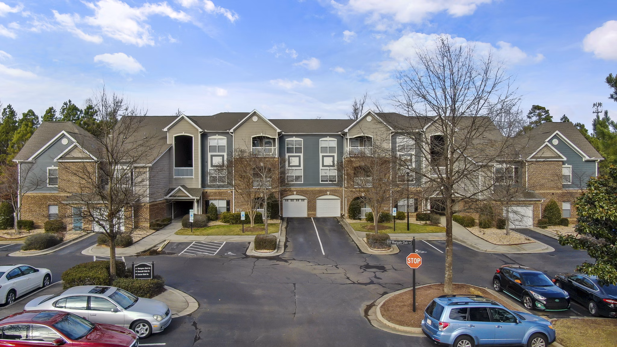 Luxury apartment complex featuring parking spaces in a vibrant community