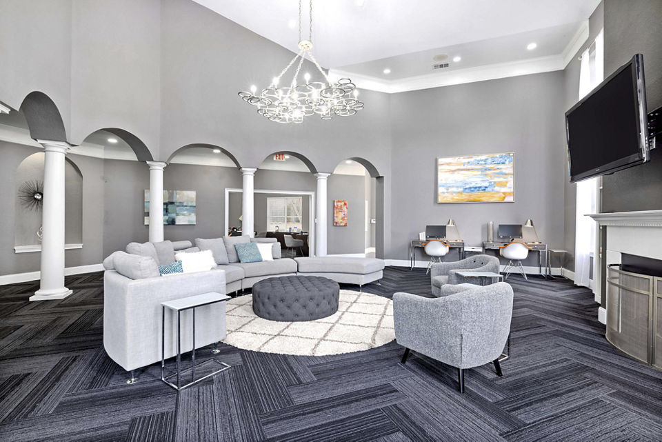 Clubhouse at Braxton at Brier Creek Apartments with modern design and comfortable seating areas for residents to enjoy community events and gatherings