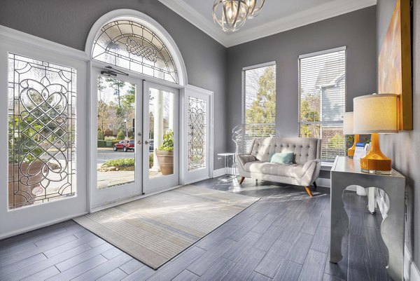 Clubhouse featuring modern seating and entertainment areas at Braxton at Brier Creek Apartments